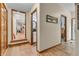 Hallway with wood floors leading to kitchen and bathroom at 14809 Senator Way, Carmel, IN 46032