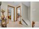 Hallway featuring carpet flooring, wood trim and doorways that offer access to other rooms at 14809 Senator Way, Carmel, IN 46032