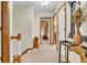 Hallway featuring carpet flooring, trim and doorways that offer access to other rooms, and decor at 14809 Senator Way, Carmel, IN 46032