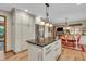 Spacious kitchen featuring island, stainless steel refrigerator, and dining area at 14809 Senator Way, Carmel, IN 46032