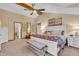 Spacious main bedroom with vaulted ceiling, decorative accents and large bed at 14809 Senator Way, Carmel, IN 46032