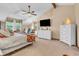 Serene main bedroom featuring vaulted ceiling, a ceiling fan, and bright windows at 14809 Senator Way, Carmel, IN 46032