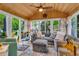 Bright sunroom with wood ceiling, large windows, and comfortable seating area at 14809 Senator Way, Carmel, IN 46032