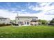 Expansive backyard with patio, fire pit, gazebo, and lush lawn, perfect for outdoor entertaining and relaxation at 16579 Lakeville Xing, Westfield, IN 46074
