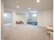 Open basement with neutral walls and carpeting offers room for storage at 16579 Lakeville Xing, Westfield, IN 46074