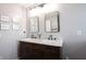 Well-lit bathroom featuring a double vanity sink with marble countertops at 16579 Lakeville Xing, Westfield, IN 46074