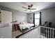Comfortable bedroom with ceiling fan, dark curtains, and ample space for a growing Gathering at 16579 Lakeville Xing, Westfield, IN 46074