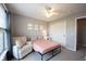 Inviting bedroom featuring a cozy armchair, a comfortable bed, and a spacious closet at 16579 Lakeville Xing, Westfield, IN 46074
