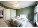 Bedroom with ceiling fan, double closets and a view into the hallway at 16579 Lakeville Xing, Westfield, IN 46074