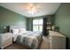 A calm bedroom with ample space and a neutral palette provides a clean slate for personalization at 16579 Lakeville Xing, Westfield, IN 46074