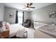 Cozy bedroom with a ceiling fan, a comfortable armchair, and a crib for a Bedroom at 16579 Lakeville Xing, Westfield, IN 46074