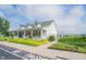 Community clubhouse with covered porch and attractive landscaping, perfect for social gatherings and events at 16579 Lakeville Xing, Westfield, IN 46074