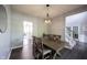 Bright dining room with wood table and stairs in the background at 16579 Lakeville Xing, Westfield, IN 46074