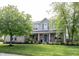 Charming two-story home with brick and siding, well-manicured lawn, and beautiful landscaping at 16579 Lakeville Xing, Westfield, IN 46074
