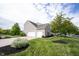 Exterior view of a home with a three-car garage, siding, and landscaping at 16579 Lakeville Xing, Westfield, IN 46074