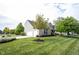 Well-manicured lawn and landscaping highlighting this home's beautiful two-car garage and inviting curb appeal at 16579 Lakeville Xing, Westfield, IN 46074