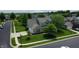Attractive home with an attached garage, a well-kept lawn, and mature landscaping in a suburban neighborhood at 16579 Lakeville Xing, Westfield, IN 46074