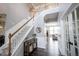 Grand foyer with staircase, modern flooring, and stylish decor, offering a welcoming entrance at 16579 Lakeville Xing, Westfield, IN 46074