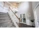 Open foyer with high ceilings, a staircase, and a glimpse of the adjacent living spaces at 16579 Lakeville Xing, Westfield, IN 46074