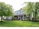 Charming two-story home with well-manicured lawn, featuring brick accents and lush landscaping at 16579 Lakeville Xing, Westfield, IN 46074