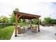 Comfortable gazebo area on a concrete patio complete with outdoor furniture, perfect for entertaining at 16579 Lakeville Xing, Westfield, IN 46074