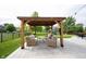 Comfortable gazebo area on a concrete patio complete with outdoor furniture, perfect for entertaining at 16579 Lakeville Xing, Westfield, IN 46074