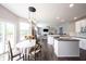 Open floor plan view with kitchen, breakfast nook, and living room; great for entertaining guests at 16579 Lakeville Xing, Westfield, IN 46074