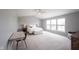 Spacious main bedroom featuring neutral walls, vaulted ceilings, large windows, and a ceiling fan at 16579 Lakeville Xing, Westfield, IN 46074
