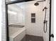 Modern shower featuring subway tile, a glass door, and a built-in bench at 16579 Lakeville Xing, Westfield, IN 46074