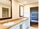 A neutral bathroom features granite countertops, double sinks, and modern fixtures at 16657 Brownstone Ct, Westfield, IN 46074