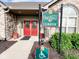 The Villas at Oak Ridge Clubhouse entrance with decorative glass doors and stone facade at 16657 Brownstone Ct, Westfield, IN 46074