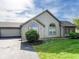 Residential home featuring stone accents, siding, a well-manicured lawn, and an attached garage with driveway at 16657 Brownstone Ct, Westfield, IN 46074
