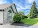 Lovely home with stone accents, mature trees, and a well-maintained lawn and landscaping at 16657 Brownstone Ct, Westfield, IN 46074