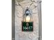 Close-up of house number 16657 on a stone wall with exterior lighting at 16657 Brownstone Ct, Westfield, IN 46074