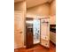 A refrigerator with an ice maker stands in the kitchen with stainless steel appliances and white cabinets at 16657 Brownstone Ct, Westfield, IN 46074