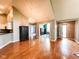 A spacious open living room with hardwood floors, a chandelier, and multiple entryways for easy access at 16657 Brownstone Ct, Westfield, IN 46074