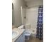 Clean bathroom with a shower-tub combo, updated fixtures, and a neutral color palette at 1716 W Witt Ave, Lebanon, IN 46052