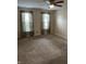 Spacious bedroom with carpet flooring, neutral walls, and plenty of natural light from dual windows at 1716 W Witt Ave, Lebanon, IN 46052