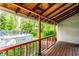 Back porch with a wooden floor overlooking a pool at 2114 Sugar Grove Ave, Indianapolis, IN 46202
