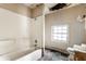 Bathroom with a white bathtub and a window at 2114 Sugar Grove Ave, Indianapolis, IN 46202