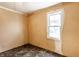 Bedroom with natural light from a window, hardwood floors, and freshly painted walls at 2114 Sugar Grove Ave, Indianapolis, IN 46202