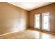 Empty bedroom with hardwood floors and two windows at 2114 Sugar Grove Ave, Indianapolis, IN 46202