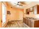 The kitchen features wood cabinets, a stainless steel sink, and a window for natural light at 2114 Sugar Grove Ave, Indianapolis, IN 46202