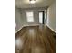 Bright living room featuring wood floors and fresh paint, perfect for relaxation at 2115 N Leland Ave, Indianapolis, IN 46218