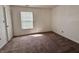 Comfortable bedroom features carpet and a bright window at 212 Woodberry Dr, Danville, IN 46122
