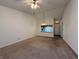 Spacious living room featuring a ceiling fan and view into the kitchen at 212 Woodberry Dr, Danville, IN 46122