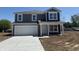 Charming two-story home with a two-car garage and freshly poured concrete driveway at 24391 Stout St, Sheridan, IN 46069