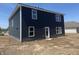 Rear view of a modern two-story home with ample windows and contemporary siding at 24391 Stout St, Sheridan, IN 46069