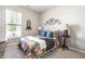 Cozy bedroom featuring a comfortable bed, stylish decor, and a bright window at 2675 Cottage Ct, Brownsburg, IN 46112