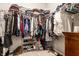 Walk-in closet provides ample storage with shelving and rods for clothes and shoes at 2675 Cottage Ct, Brownsburg, IN 46112